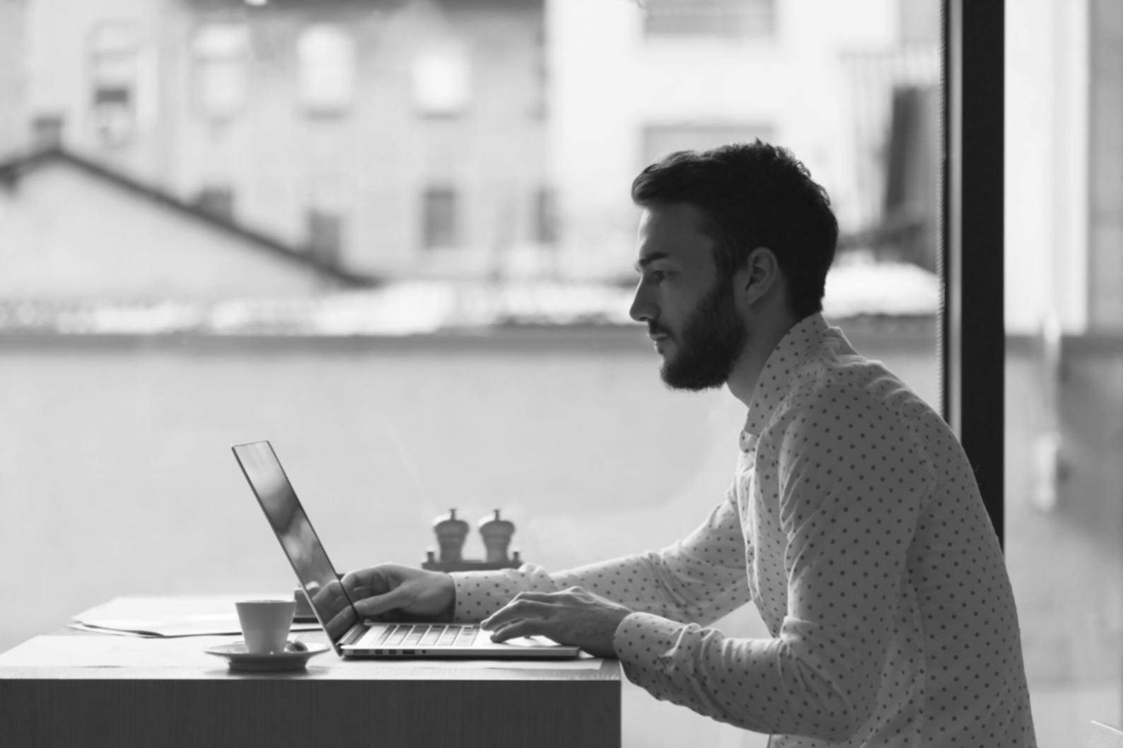 Financial analysis workspace with documents and laptop